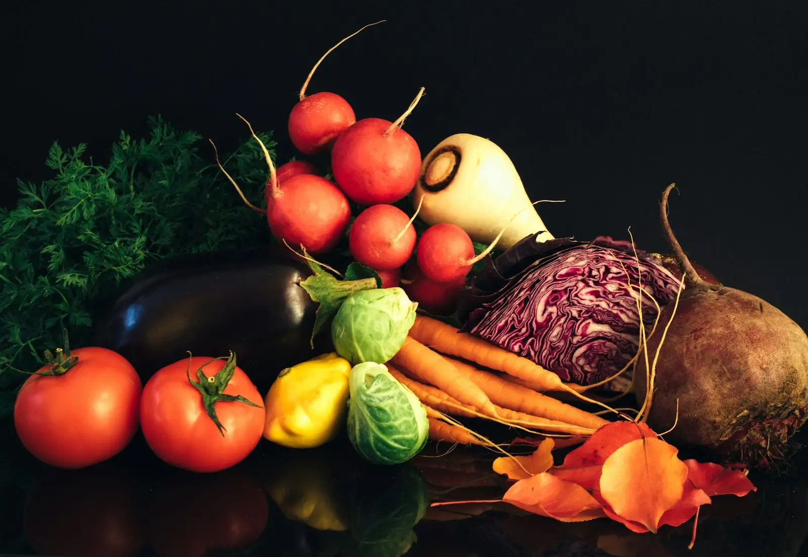 Fresh vegetables: tomatoes, radishes, carrots, red cabbage, eggplant and beetroot